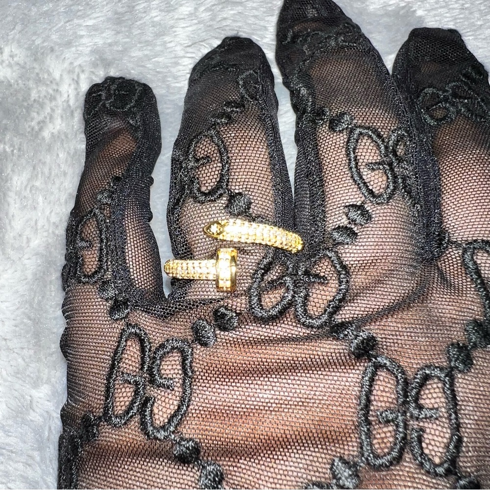 Adjustable Yellow Gold plated nail ring with cubic zirconia diamonds.
